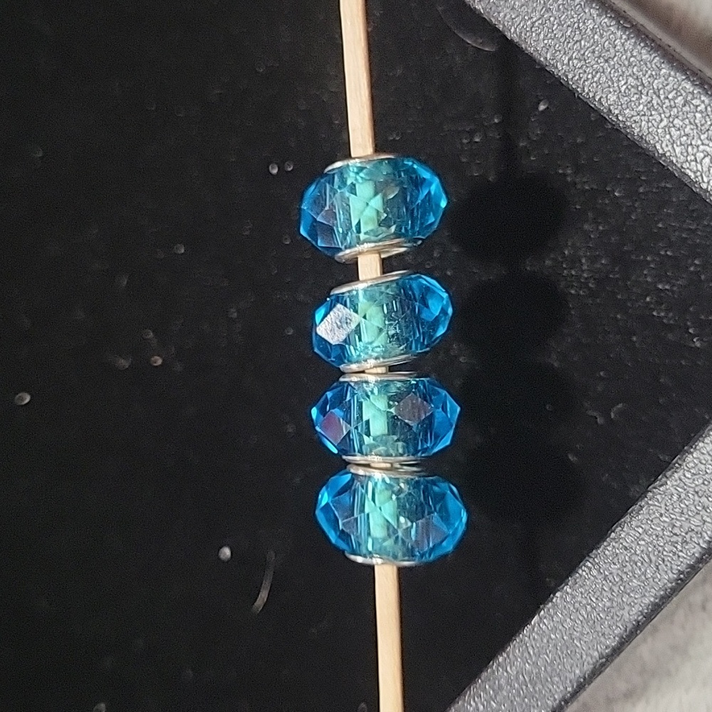 Set of 4 925 silver and glass charms/beads
